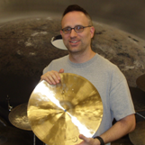 Teacher holding a cymbal
