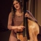 Teacher Julia Higgins on stage playing stand up bass