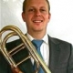 Teacher Sean Mcghee hold his trombone
