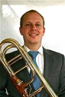 Teacher Sean Mcghee hold his trombone