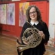 Teacher Emily Toth holding her french horn