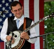 Teacher Tyler Mullins playing a banjo