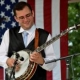 Teacher Tyler Mullins playing a banjo